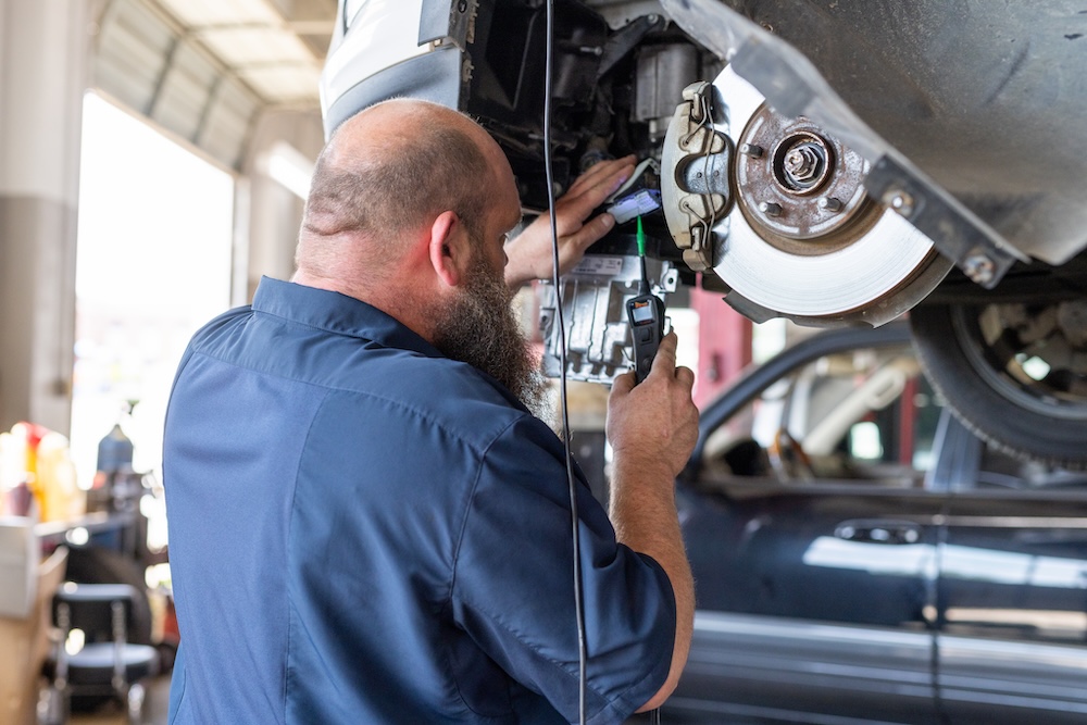 Lorentz Automotive - Denton and Prosper Branding Session The technician was inspecting the car’s brake pads when he noticed that they were severely worn. He determined that the brake pads had to be replaced immediately.